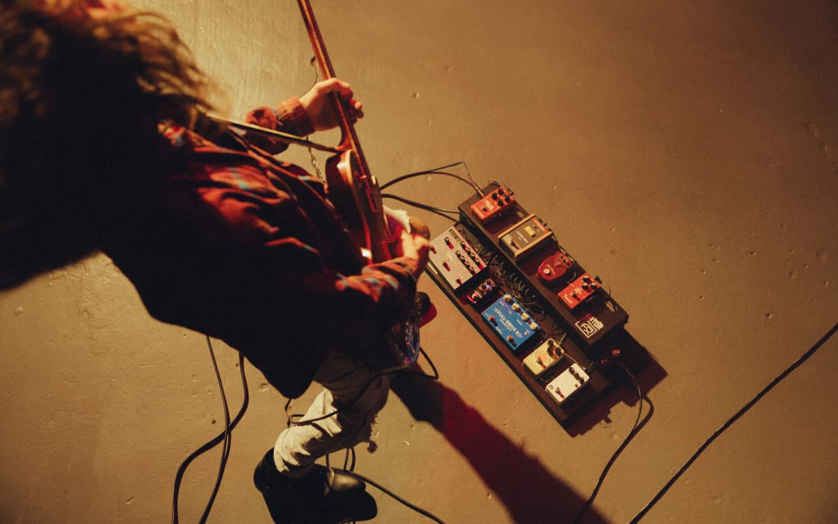 Guitarist on stage with a Rig Doctor board